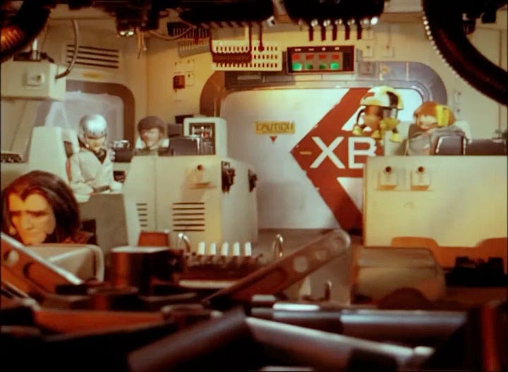 The bridge of X Bomber after a crash. PPA lies on the floor
