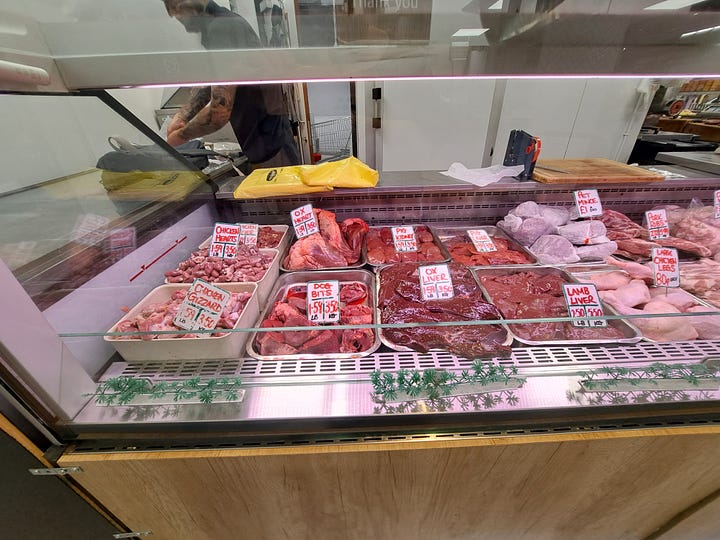 Barnsley Market; butcher counter, and Pauls Cafe menu