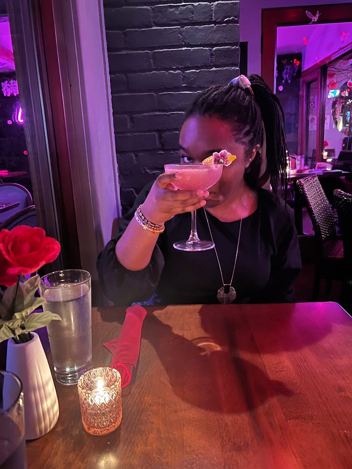 4 photos of me smiling and posing with my cocktail at a restaurant; smiling, with my eyes closed in a scrunched up face, sassily looking away from the camera, and cheers-ing to the camera while peeking out from behind the drink)