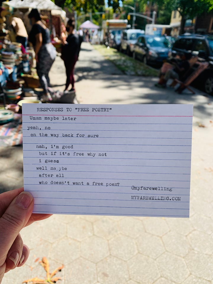 writing poetry and signing books in a park in New York City