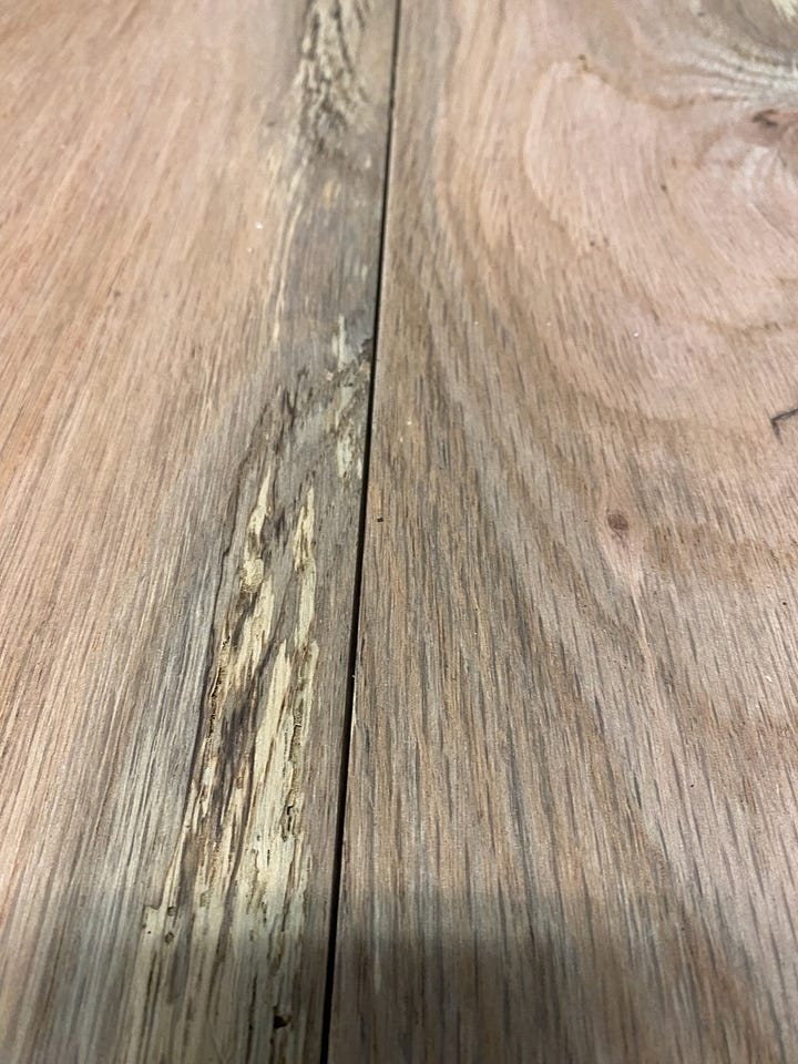 Reclaimed wood being sawed.