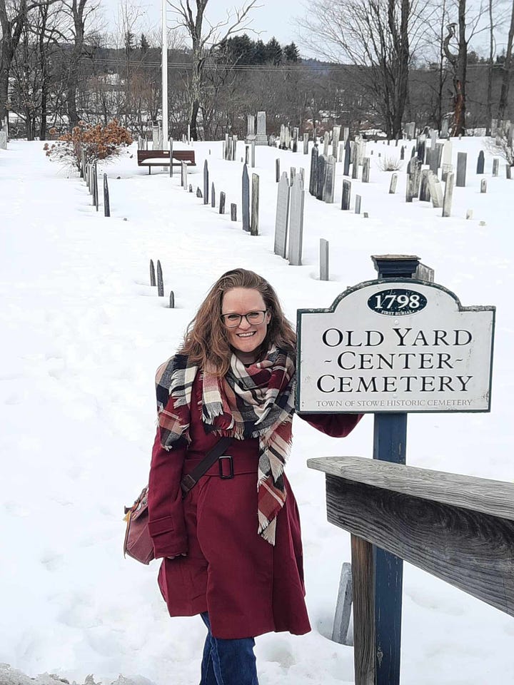 Amber, wearing a burgundy coat, (top L to bottom R) stands beside a sign for the Old Yard Cemetery, stands under a sign for the Green Mountain Inn, stands at the Stowe, Vermont covered-bridge style walkway, and stands beside a festive light post.