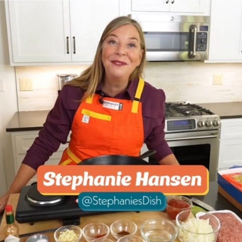 Stephanie in the kitchen with her dog.