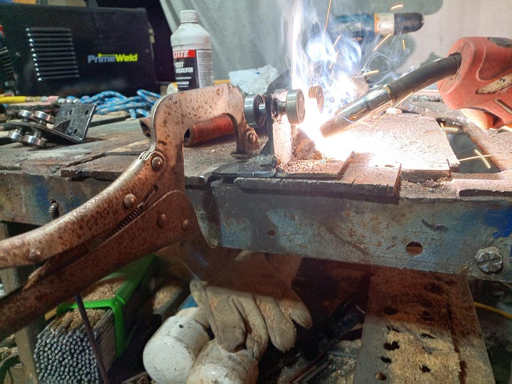 Photos of the trolleys being fitted and welded up.