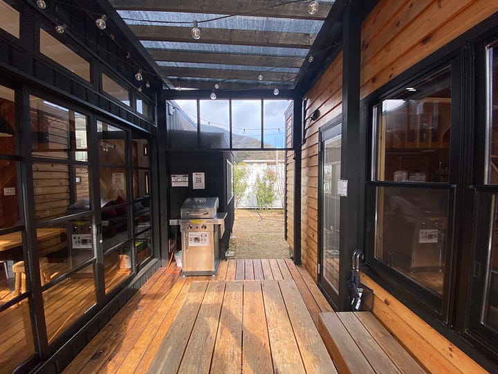 Bedroom, kitchen, patio of Tiny Base River House in Kawazu, Shizuoka, Japan.