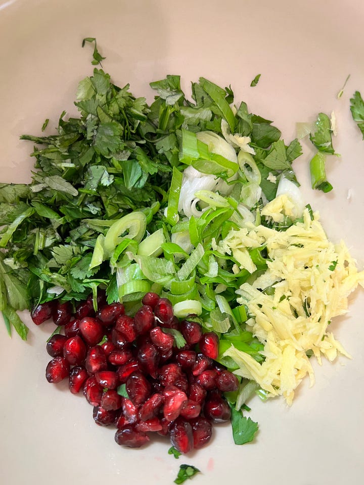 bowl with cilantro, scallions, ginger, pomegranate