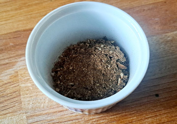 1. Chopped and roasted chunks of root on a plate. 2. Ground into a fine brown powder. 3. Brewing in a glass cafetiere. 4. Dark brown dandelion coffee in a white cup.