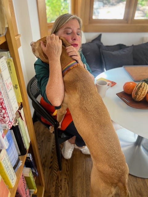 Stephanie in the kitchen with her dog.