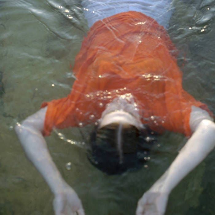 Left: Quickly Quickly Vol. 1 cover art, photograph of Mt. Adams; Right: Mia Gargaret cover art, photograph of Gia Margaret floating in water