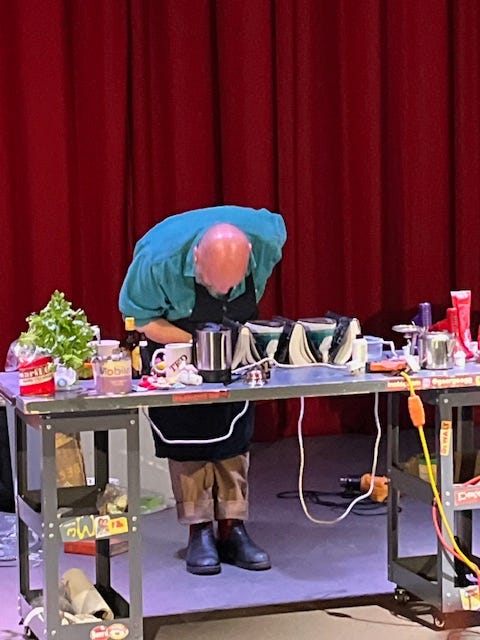 Several images of the comedy chef George Egg on stage in front of a red curtain and behind a table topped with ingredients and cooking tools