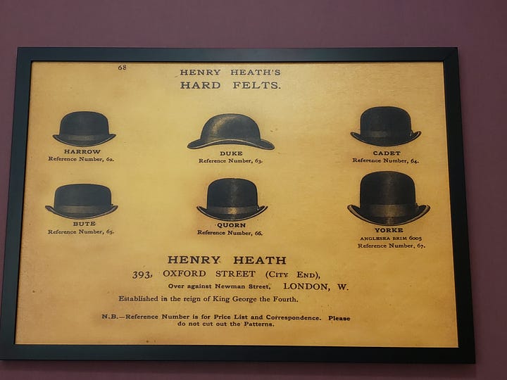 Reference to the Tress & Co. hat factory is part of the room decor.