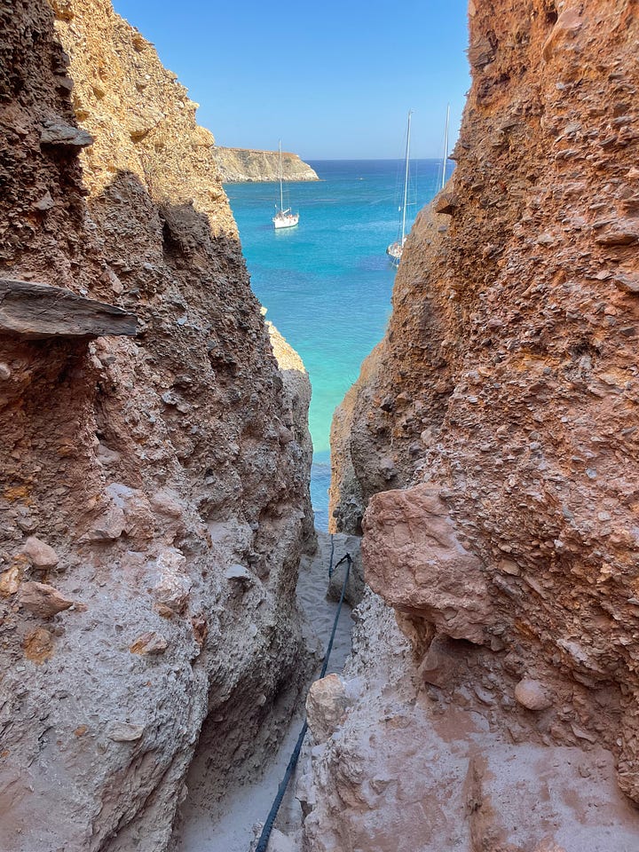 The first image on the left is of a rocky entrance to a beach in Milos Greece, and the second image on the left is of Sawyer Wilson, a freelance copywriter, standing by a ladder in a bikini on the beach.