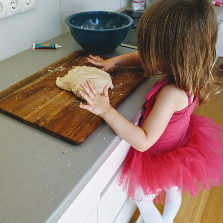 the photo shows a girl at 9 baking bread. In the photo on the right hand side, the same girl is making play dough at the age of 3