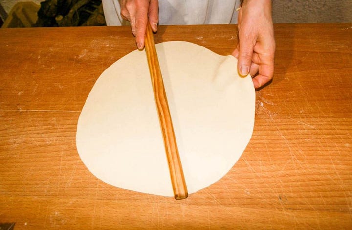 rolling out dough for pane carasau