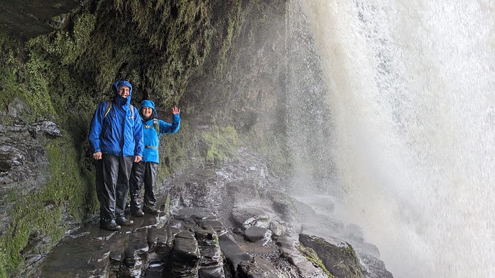 two hikers in the waterfalls area of the brecon beacons