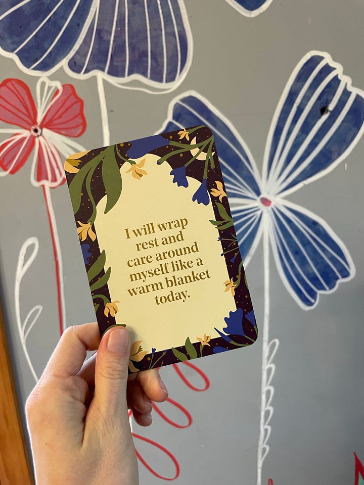 First Image of Lyss in brightly colored hanging lights, looking gleeful. Second photo of colorful cloth hanging from a line in the air. Third photo of a card from the Rest Deck that says "I will wrap rest and care around myself like a warm blanket today." Fourth photo of a gorgeous pink peony blossom.