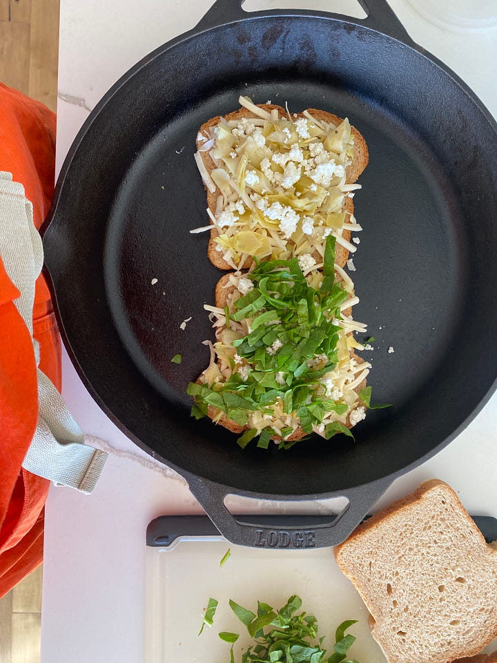 spinach and artichoke grilled cheese, in the pan and on the plate