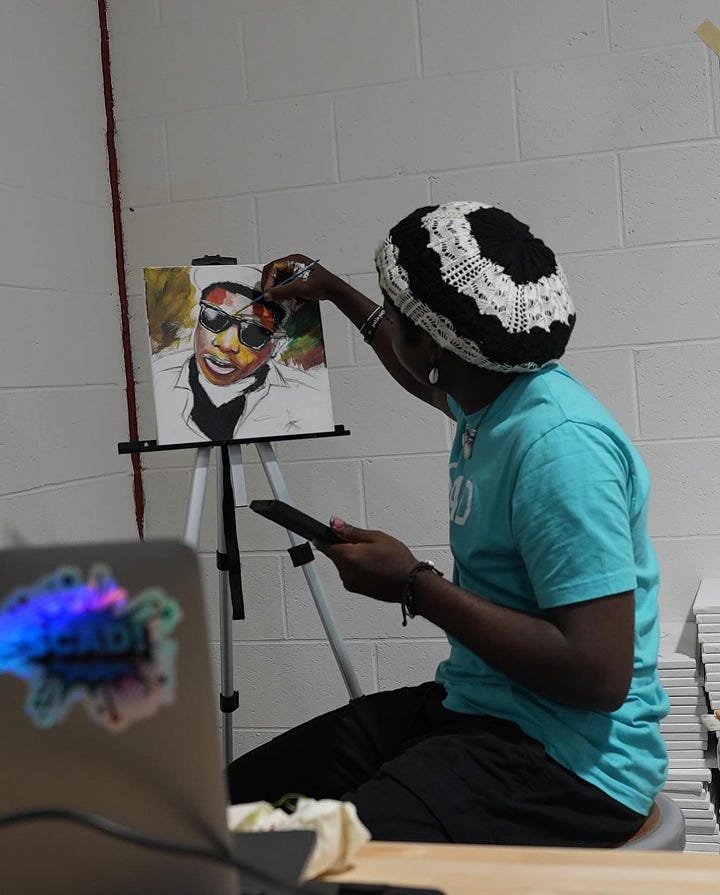 Chancellor Ahaghotu painting during the painting marathon