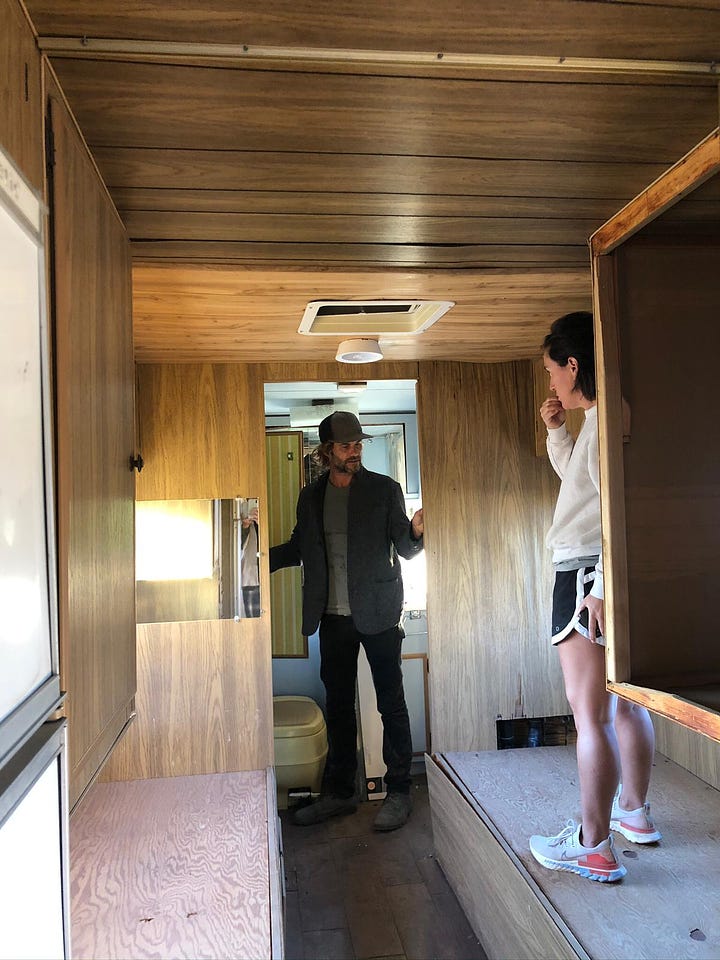 One row of two photos, left to right: Photo of woman and man standing talking determinedly in the wooden interior of an RV camper; cell phone mirror selfie of woman in an RV camper with bathroom in the background and kitchen sink in the foreground.
