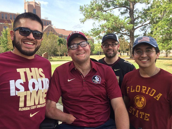 John pictured with friends outside a college football stadium, and also with friends around a restaurant table.