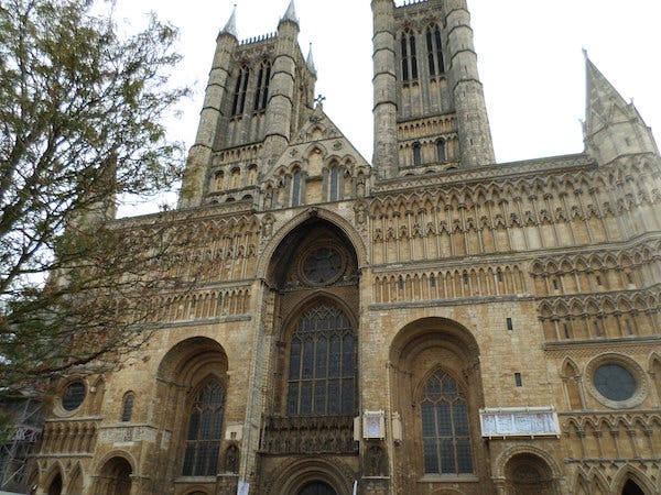 t.l: Exchequer Gate between the castle and the cathedral; T.R.: the Lucy Tower in the castle; L.L: ruins of the Medieval Bishop's Palace; L.R. Lincoln Cathedral