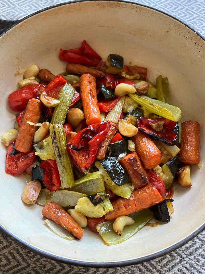 A pot of roasted vegetables. A pot of sauce.