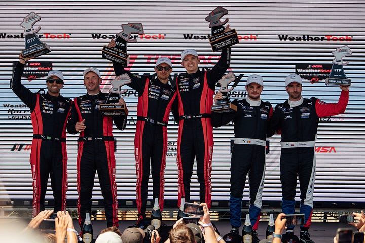 Team Penske Porsche celebrates another IMSA championship win as BMW M Team RLL looks on at Laguna Seca in May 2025. Photos by Walter Fulbright.