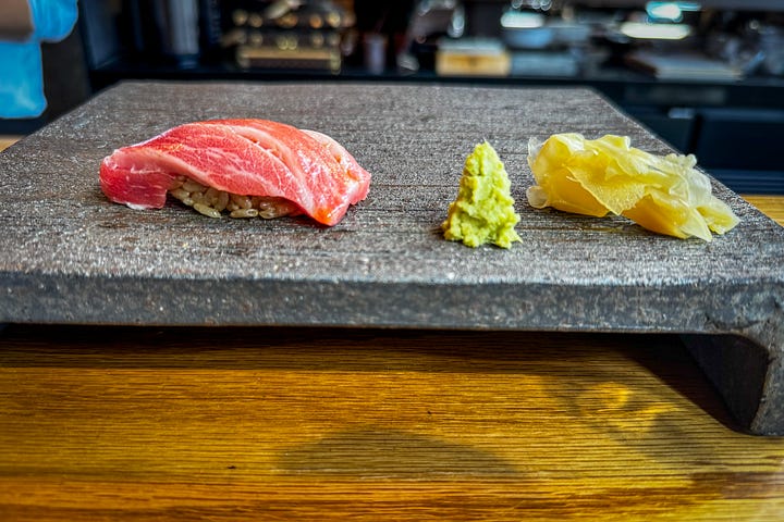 A selection from the sushi omakase: botan shrimp, blushing fatty tuna, ochre creamy uni and conger eel.