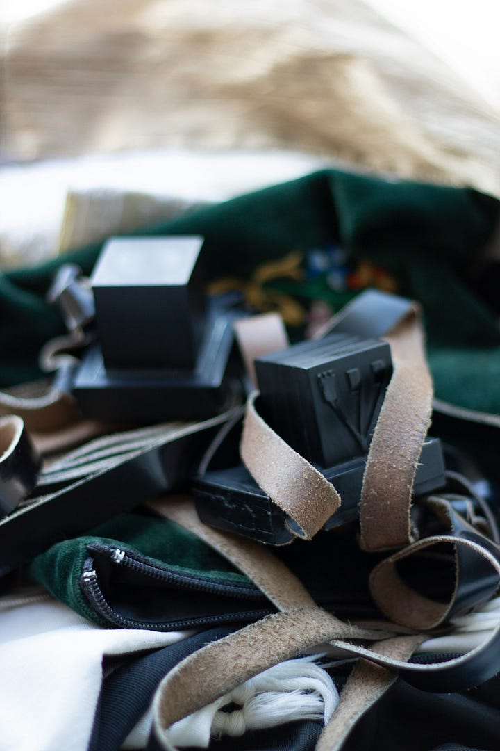 Left: tefillin wound on right arm of man holding prayerbook; right: tefillin on a table