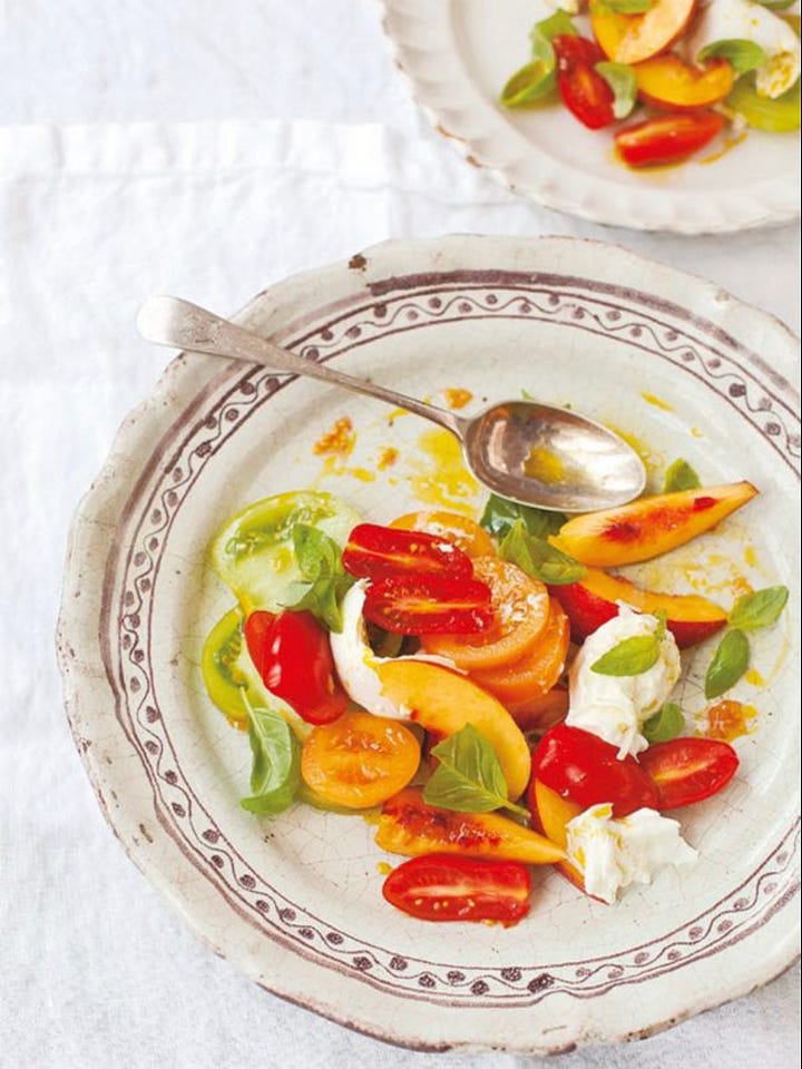 Nectarine & orange salad on vintage plate, peach & serrano ham salad with white beans & mozzarella, tomato salad with burrata & wild garlic pesto, cheeseboard with 4 cheeses, one covered in flower petals