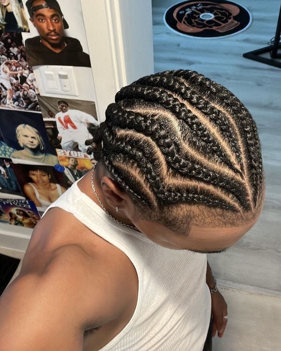 Two different images at different angles showing a Black man with cornrows. In right photo man holds a phone as if taking a selfie, with tape over eyes.