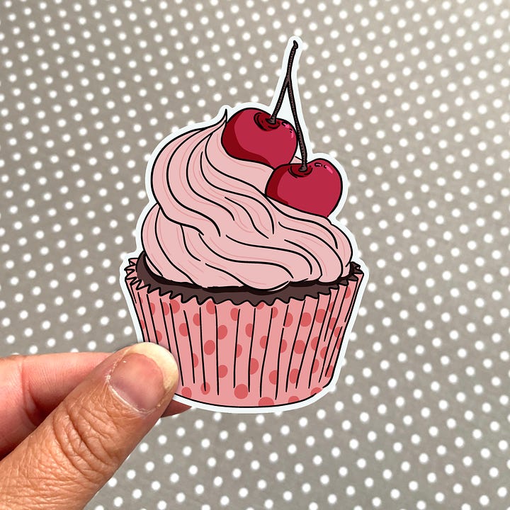 two cupcake stickers a red velvet cupcake with candy sticks and a black forest cupcake with 2 cherries, a coral pink peony sticker and a golden sunflower sticker