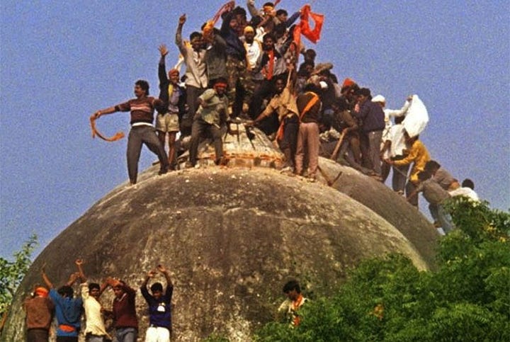 Mobs climb on top of Babri masjid, 6 December, 1992.