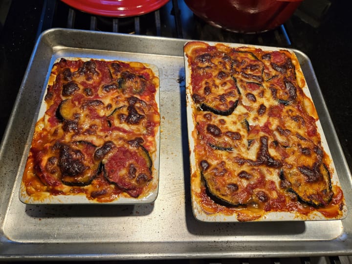 Left: two small pans of cooked eggplant “lasagna”.  Right: eggplant lasagna layers after cutting out a slice.