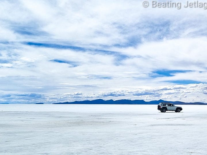 Views of Salar de Uyuni and a volcano in the desert in Bolivia