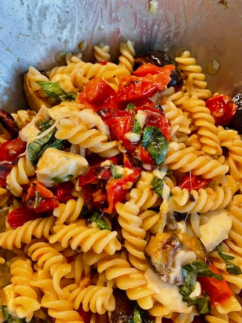 Roasted Eggplant and Tomato fabulousness fusilli basil red pepper in a bowl with a spoon