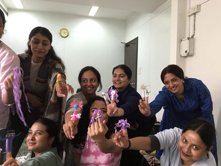 Participants on the NDP India course making puppets