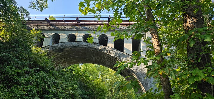 1) The bridge at a distance 2) the underside of the bridge 3) Hannah House 4 The gate and walk leading to the Hannah House Front door.