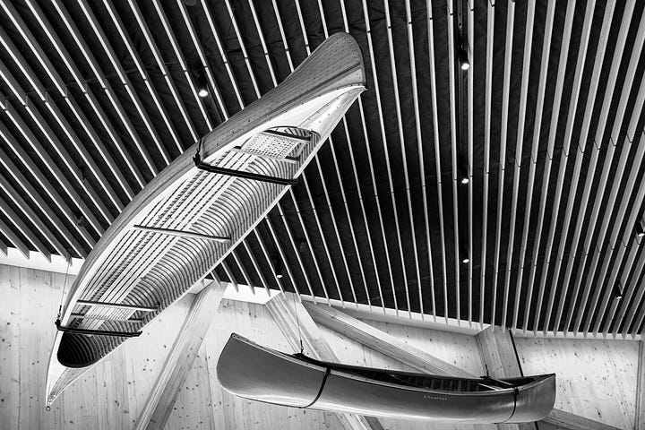 Suspended canoes in main lobby.