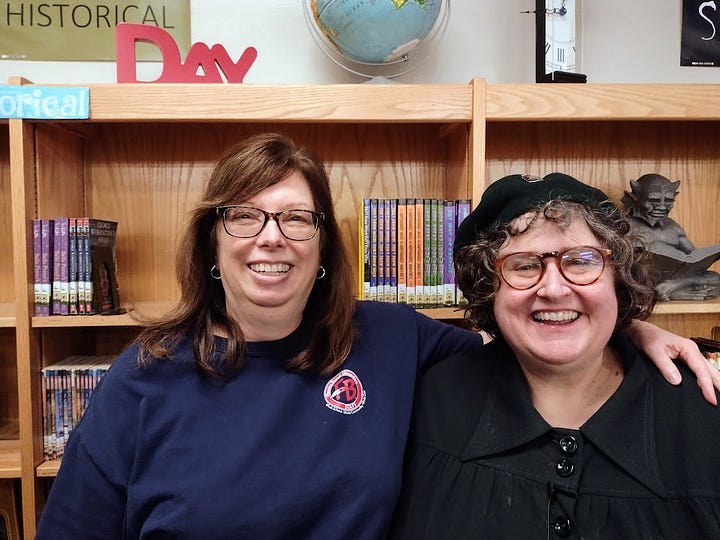 Annette with Karen in front of bookshelves, Annette with three kids and books