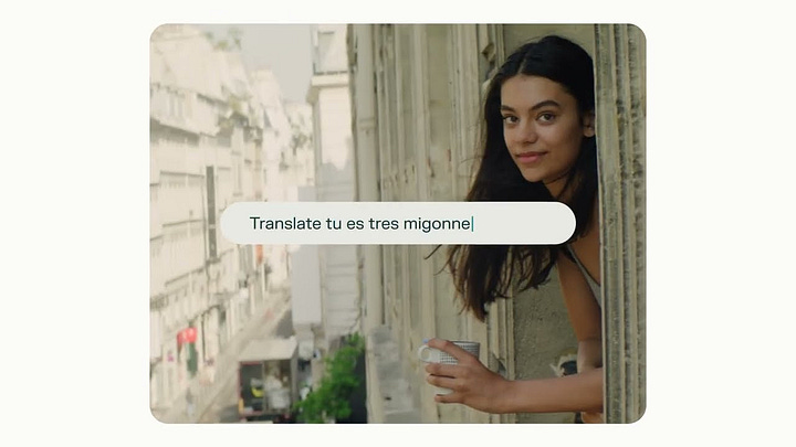 First Image: A screenshot of the Google search engine with the search query "long distance relation" typed in the search bar. The autocomplete suggestions include "long distance relationships," "long distance relationship quotes," "long distance relationship advice," "long distance relationship songs," "long distance relationship tips," "long distance relationship ideas," and "long distance relationship statistics." Second Image: A woman leaning out of a window in a picturesque European city. A translation search is shown on the screen, with the text "Translate tu es tres mignonne" typed in. The woman is holding a cup and smiling softly, with a charming street scene visible in the background.