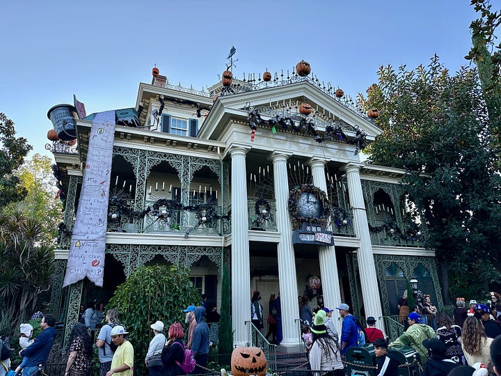 Disneyland castle Christmas lights, Haunted Mansion Holiday decor, Jack Skellington character meet and greet, Mater in his Halloween costume