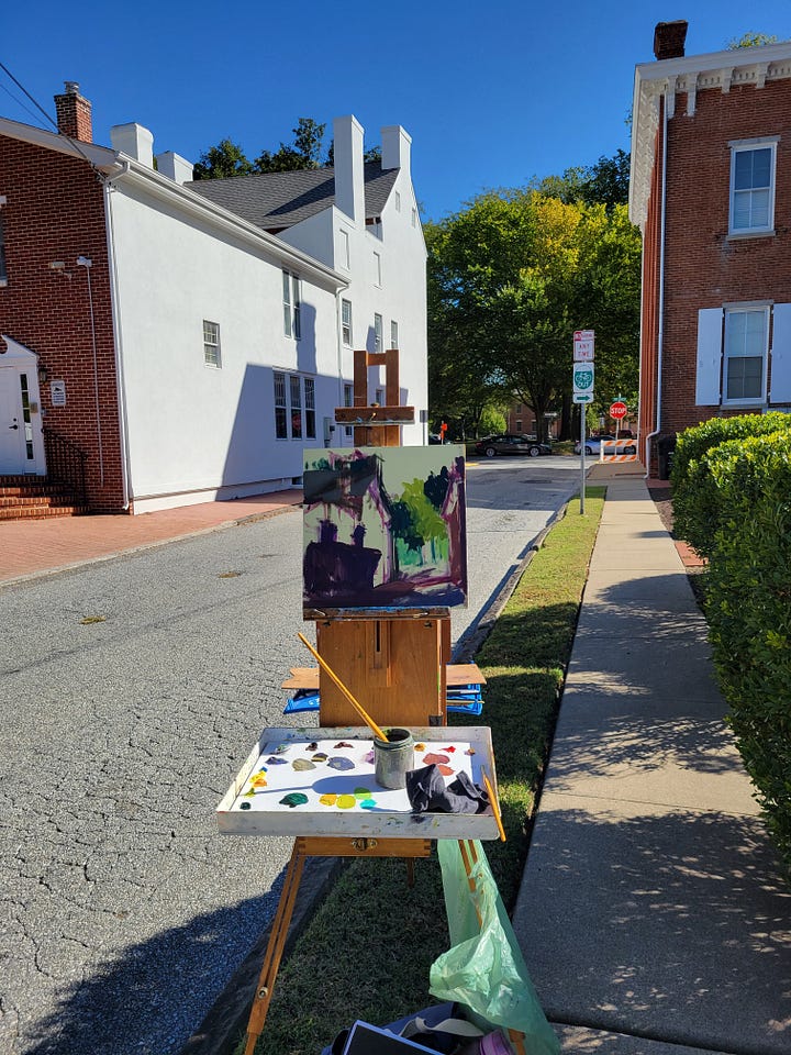 landscape paintings in progress and the final set up at the Biggs Museum
