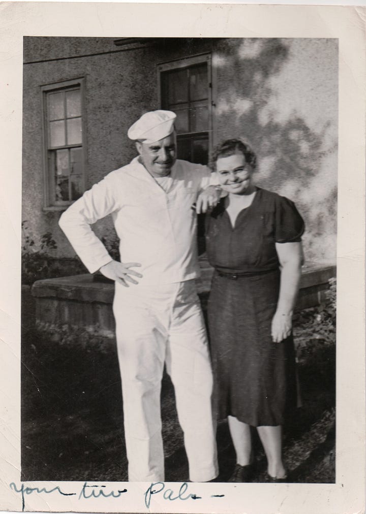 A man with a Reston Runners short on finishing a marathon, and a man in a navy uniform standing next to his mother