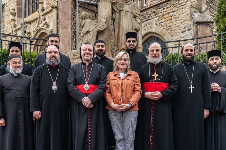 Elke with bishops and priests