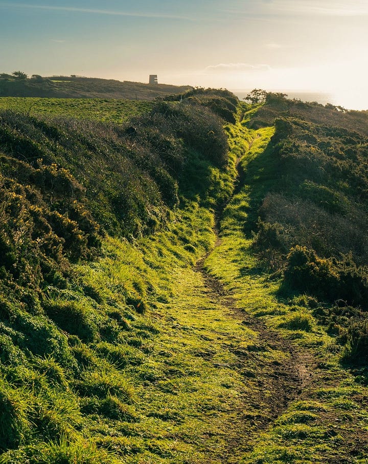 Local views of the island: Cliff Path in St Peters; Torteval Church from across the field; Torteval Church up close; autumn on the Guernsey Cliff Path. Photos by Peter Tiffin.