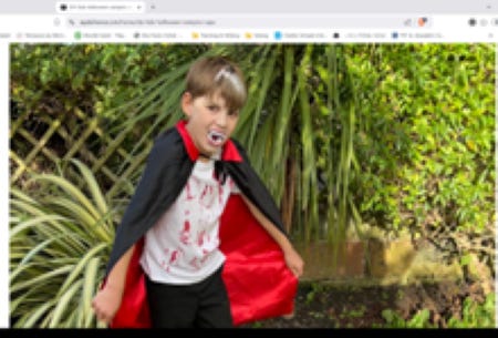 picture of woman's mask with bloody eyes, mouth and tears; young boy with vampire teeth, black cape lined with red and t-shirt with fake blood on it