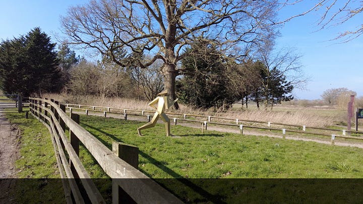 The Animal Park cafe at Southwick Country Park and the running man artwork a the entrance of Southwick Country Park, Trowbridge, Wiltshire