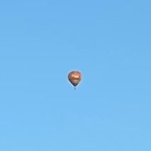 Hot air balloons fly in the sky in Canberra, Australia