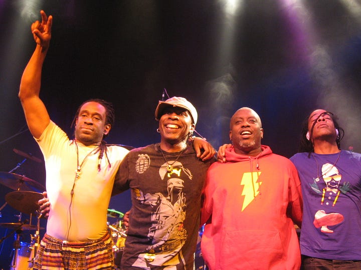 Photographs of Living Colour album covers and the band performing live